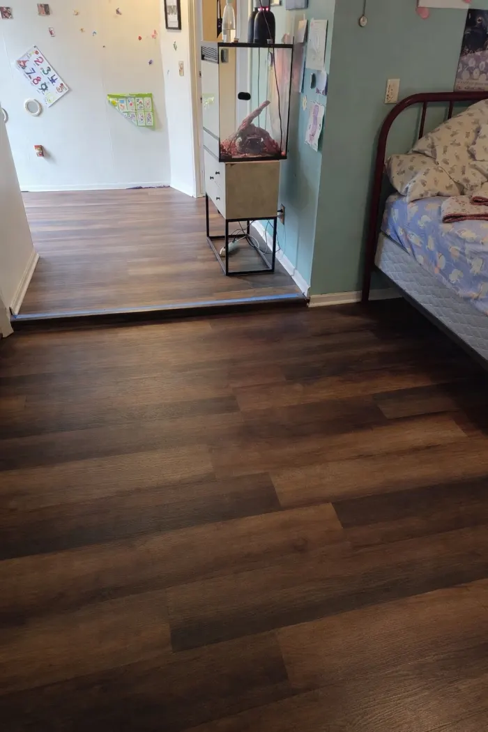 Luxury vinyl plank flooring in a bedroom